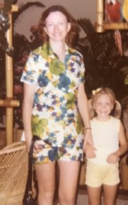 Nancy and Andrea in a tropical setting at sundown, smiling