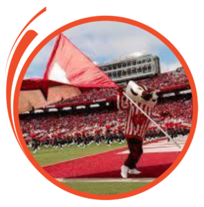 Bucky Badger waving the UW Madison flag at Camp Randall